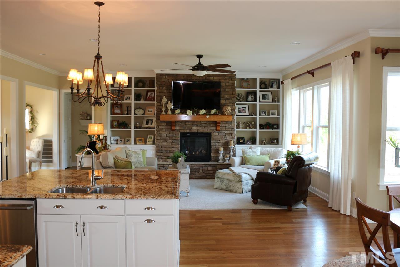 1108 Overlook Ridge Road Wake Forest, NC 27587 - Photo 5 of 14 a living room with fireplace furniture and a flat screen tv