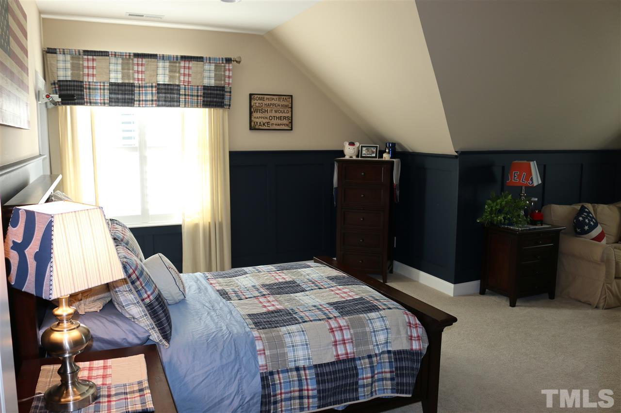 1108 Overlook Ridge Road Wake Forest, NC 27587 - Photo 10 of 14 a bedroom with a bed and walk in closet