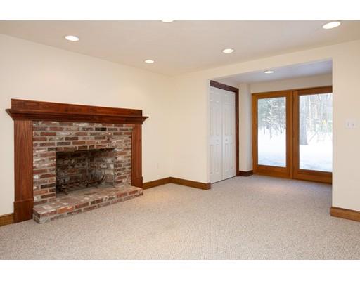 62 Woodridge Road Wayland, MA 01778 - Photo 9 of 11 a view of an empty room with a fireplace