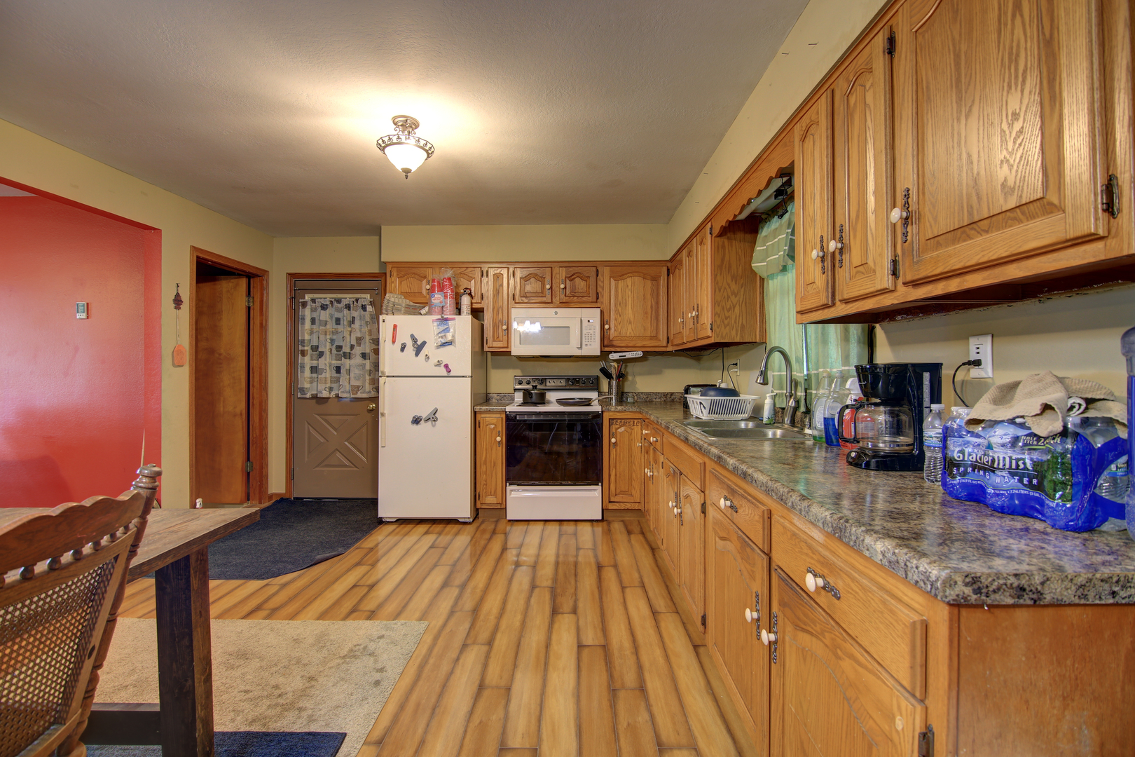134 Summer Road Dixon, IL 61021 - Photo 5 of 34 a kitchen with granite countertop stainless steel appliances and wooden cabinets