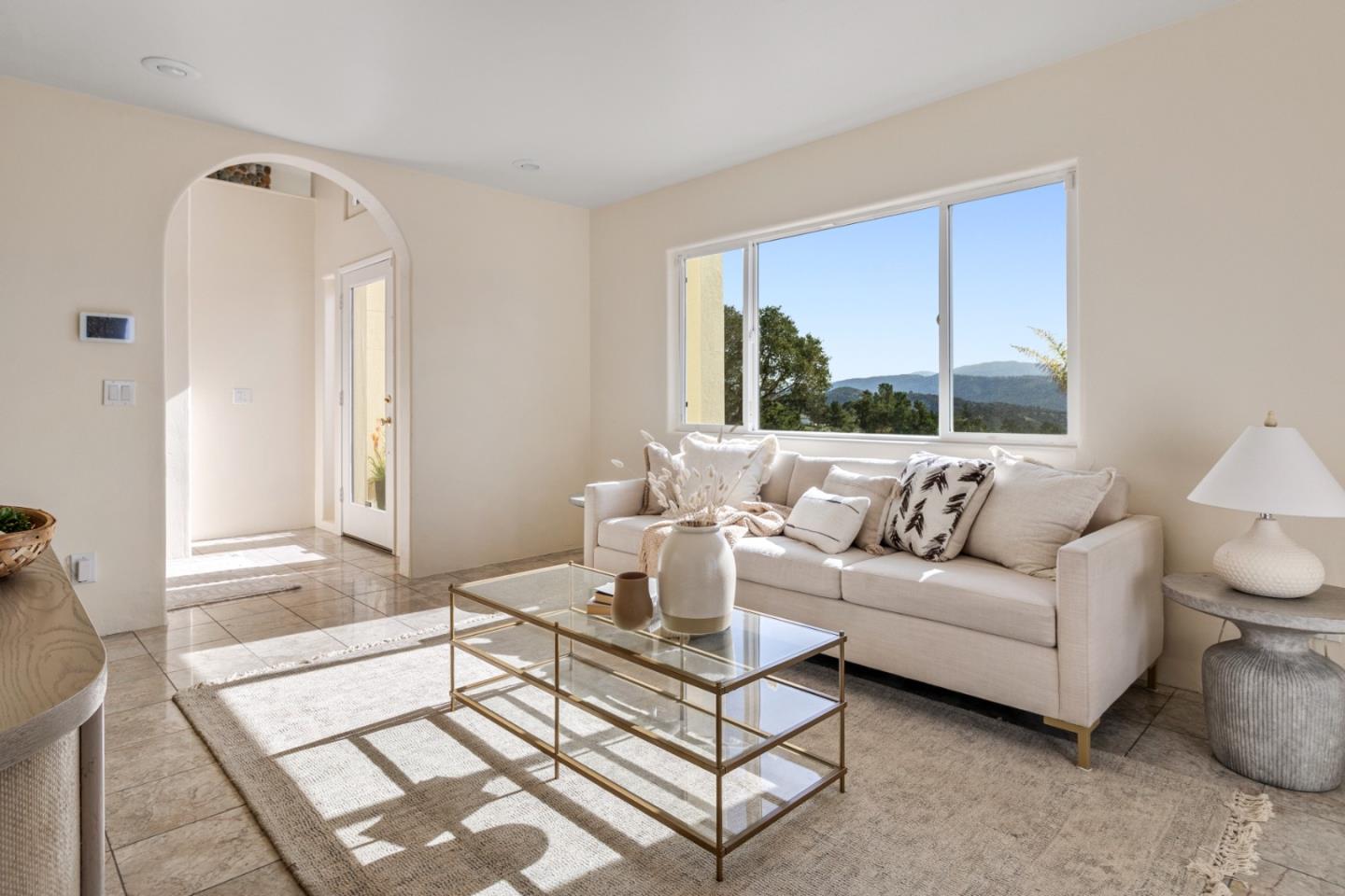 320 El Caminito Road Carmel Valley, CA 93924 - Photo 9 of 62 a living room with furniture a large window and a table