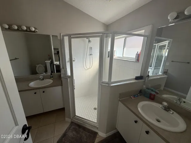 a view of a patio with couches table and chairs and potted plants