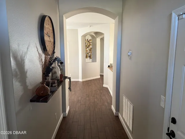 a view of a entryway door with wooden floor