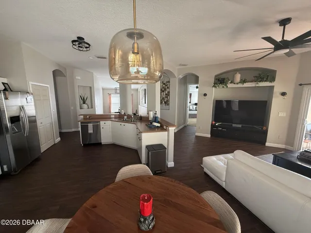 a kitchen with stainless steel appliances a refrigerator stove and microwave