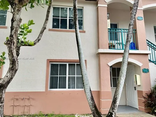 a front view of a house with large windows