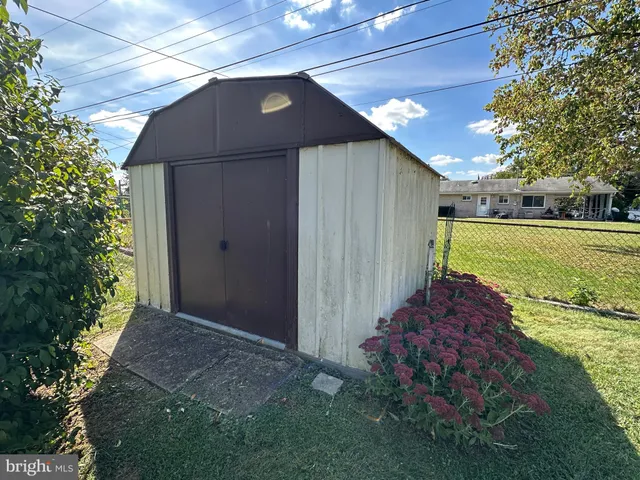 a kitchen with a sink cabinets and a stove