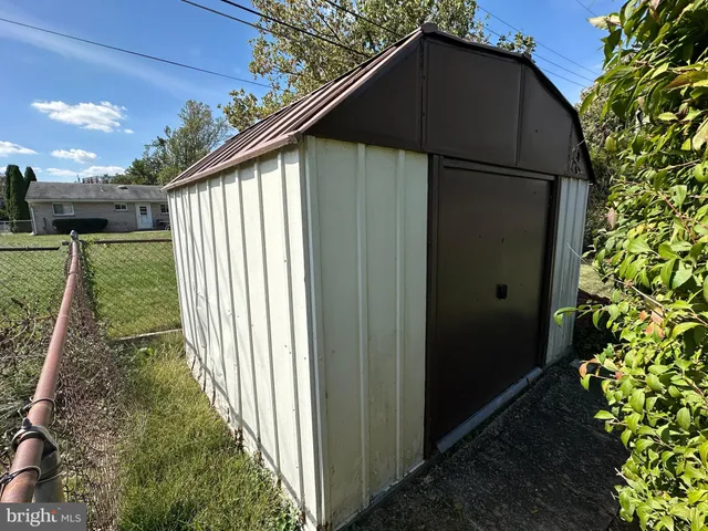 a kitchen with a sink cabinets and window