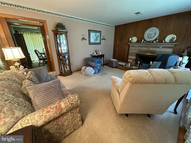 a bathroom with a tub a sink and glass door