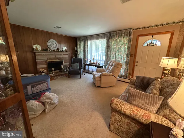 a bed sitting in a room next to a window