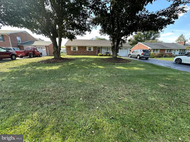 a view of house with outdoor space and shower