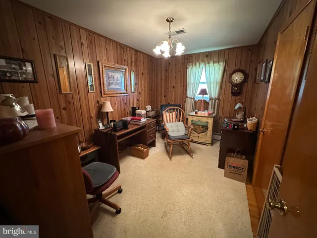 a view of a hallway with wooden door