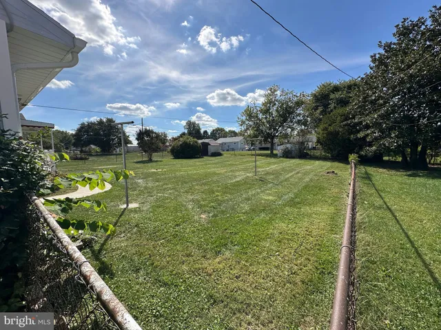 a front view of a house with a garden and porch