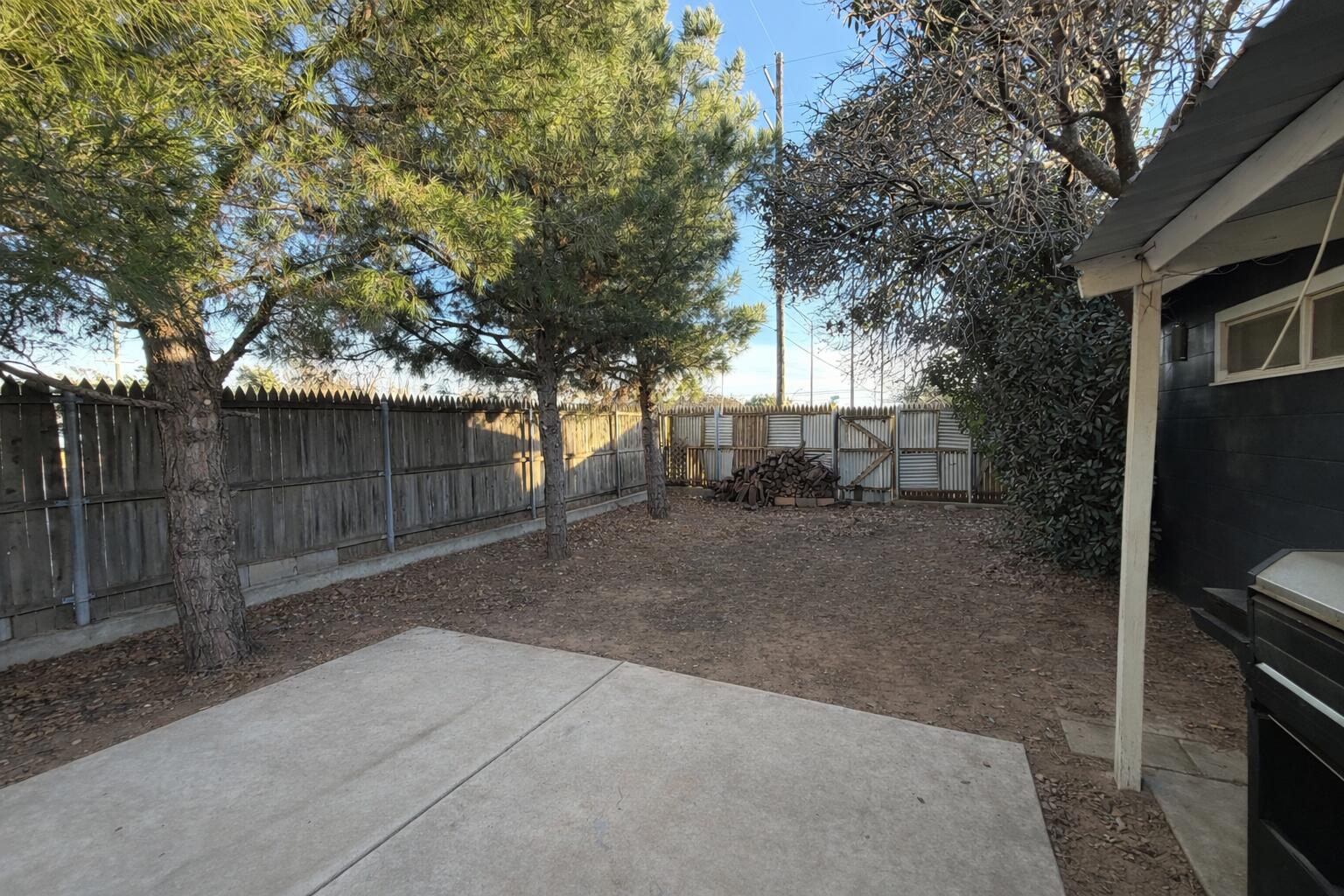 3404 42nd Street Lubbock, TX 79413 - Photo 11 of 12 a view of backyard with trees