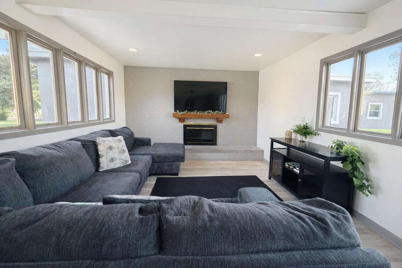 3404 42nd Street Lubbock, TX 79413 - Photo 2 of 12 a living room with furniture and a flat screen tv