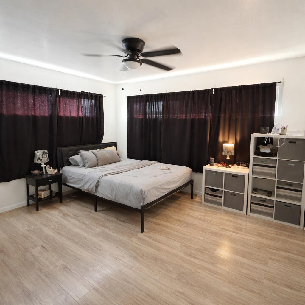 3404 42nd Street Lubbock, TX 79413 - Photo 6 of 12 a bedroom with a bed and a dresser
