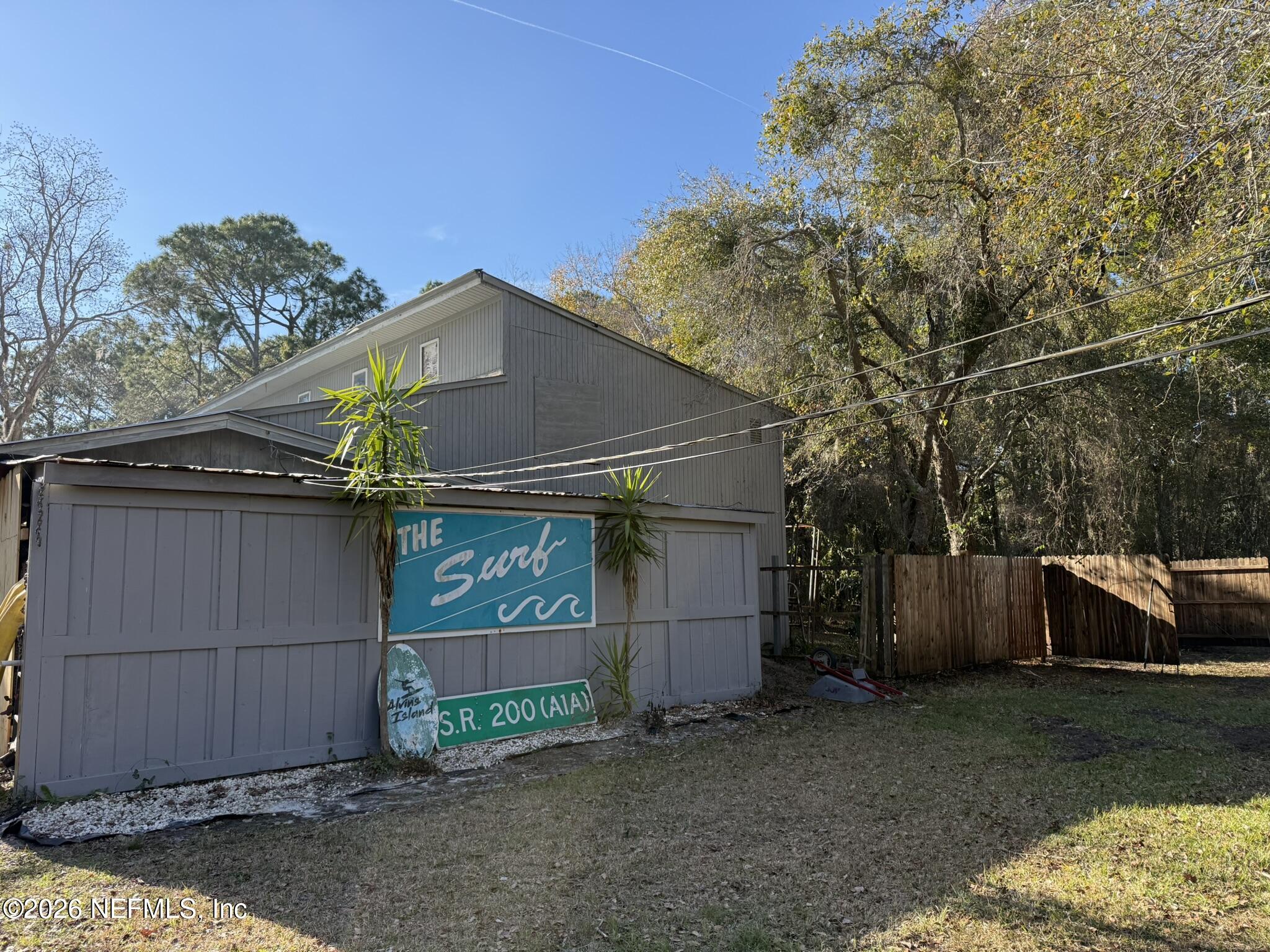 95291 Alligator Creek Road Fernandina Beach, FL 32034 - Photo 10 of 27 a front view of house with a garden