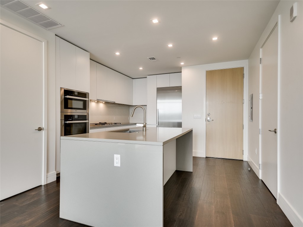 501 West Avenue, Unit 1802 Austin, TX 78701 - Photo 8 of 35 a view of kitchen with stainless steel appliances a refrigerator and a stove top oven