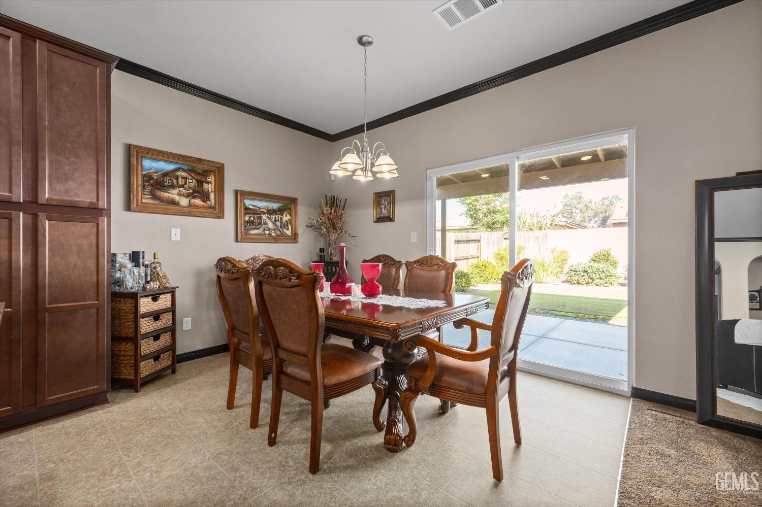 Undisclosed Address Bakersfield, CA 93313 - Photo 15 of 28 a dining room with furniture a chandelier and window