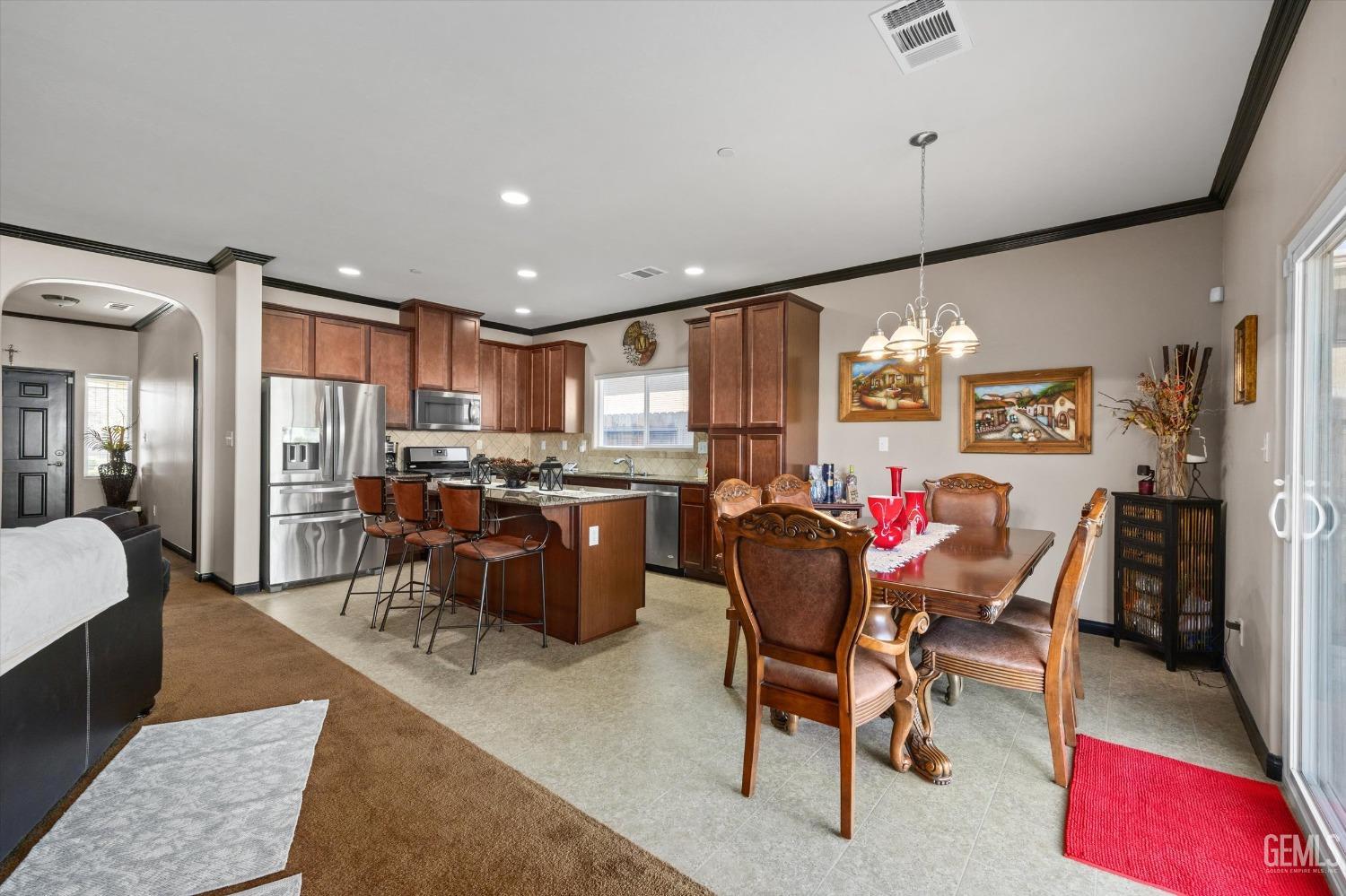 Undisclosed Address Bakersfield, CA 93313 - Photo 16 of 28 a view of a dining room with furniture