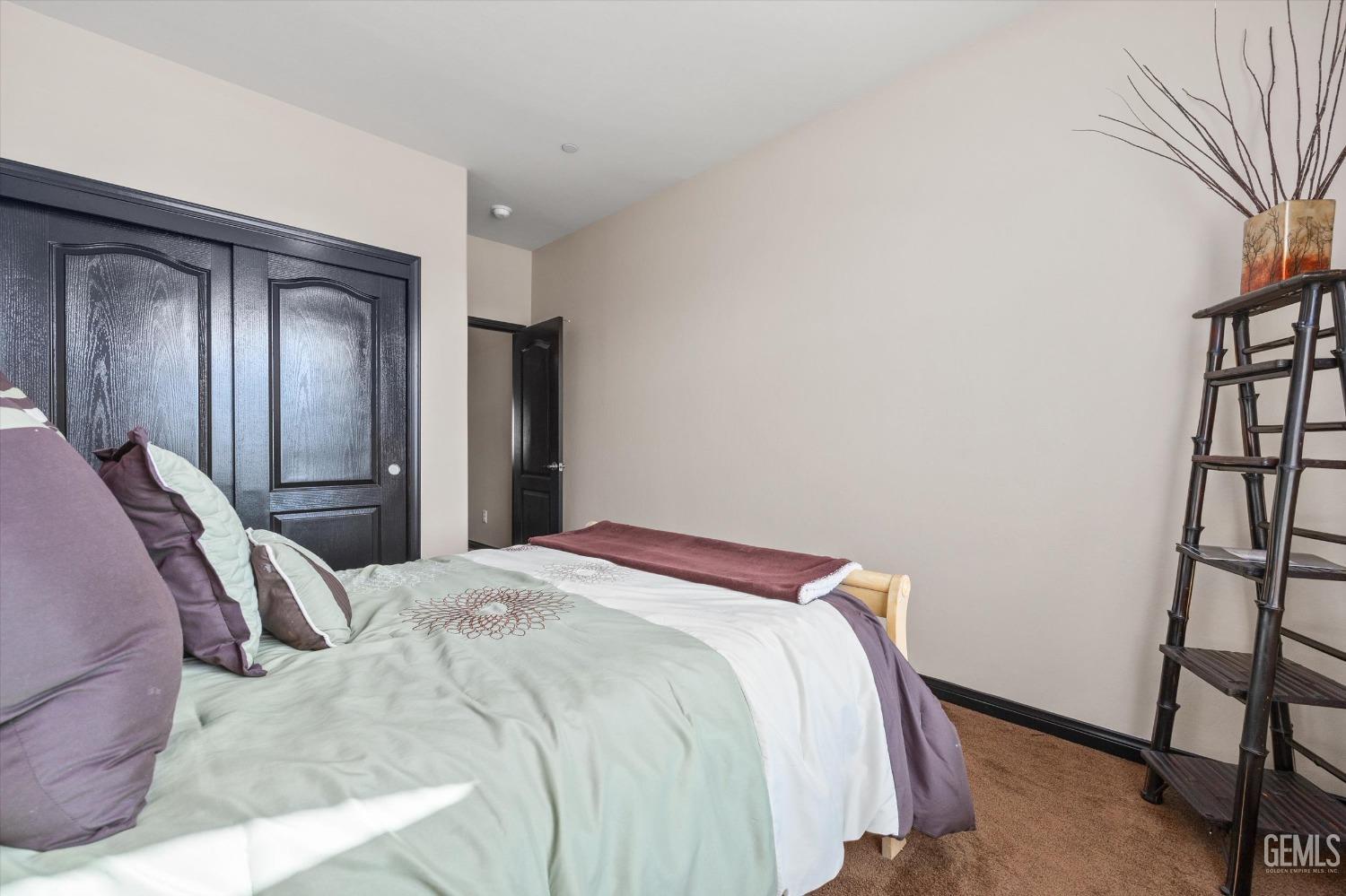 Undisclosed Address Bakersfield, CA 93313 - Photo 19 of 28 a bed sitting in a bedroom next to a window