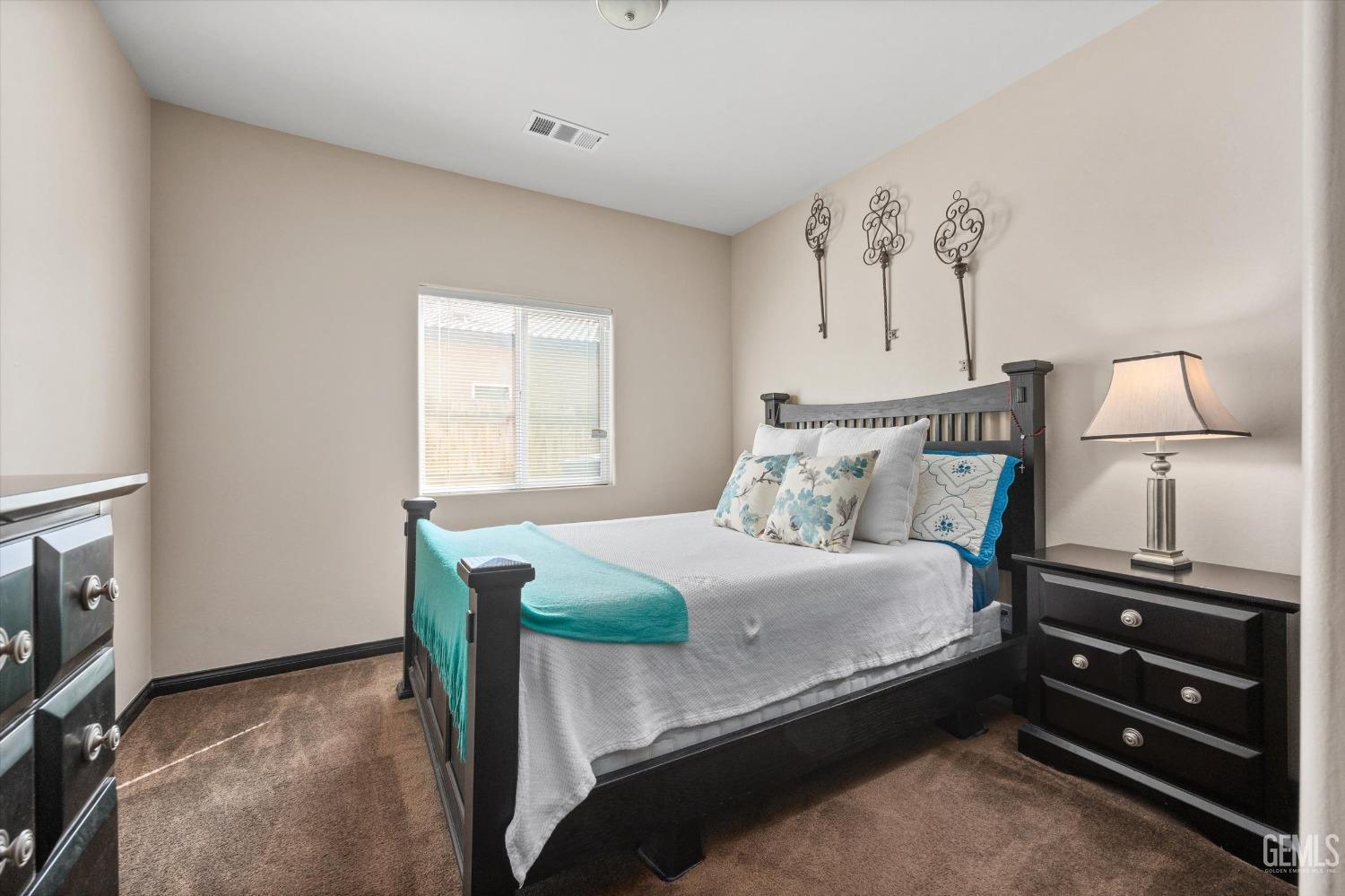 Undisclosed Address Bakersfield, CA 93313 - Photo 22 of 28 a bedroom with a bed and a tv