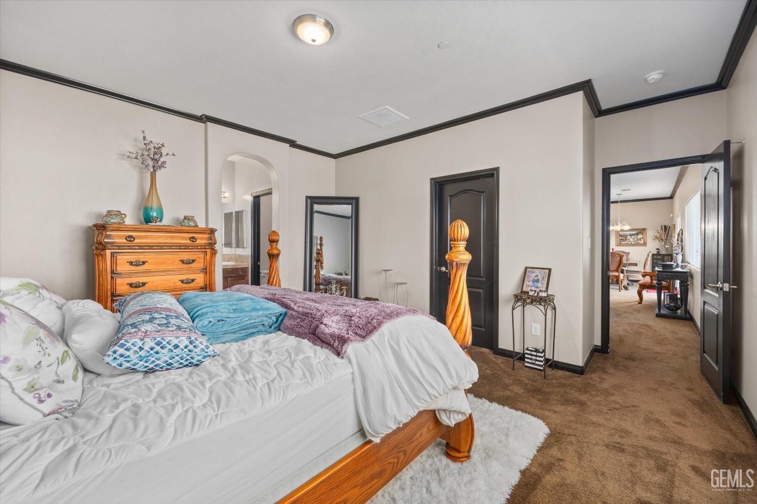 Undisclosed Address Bakersfield, CA 93313 - Photo 24 of 28 a bedroom with a bed and wooden floor