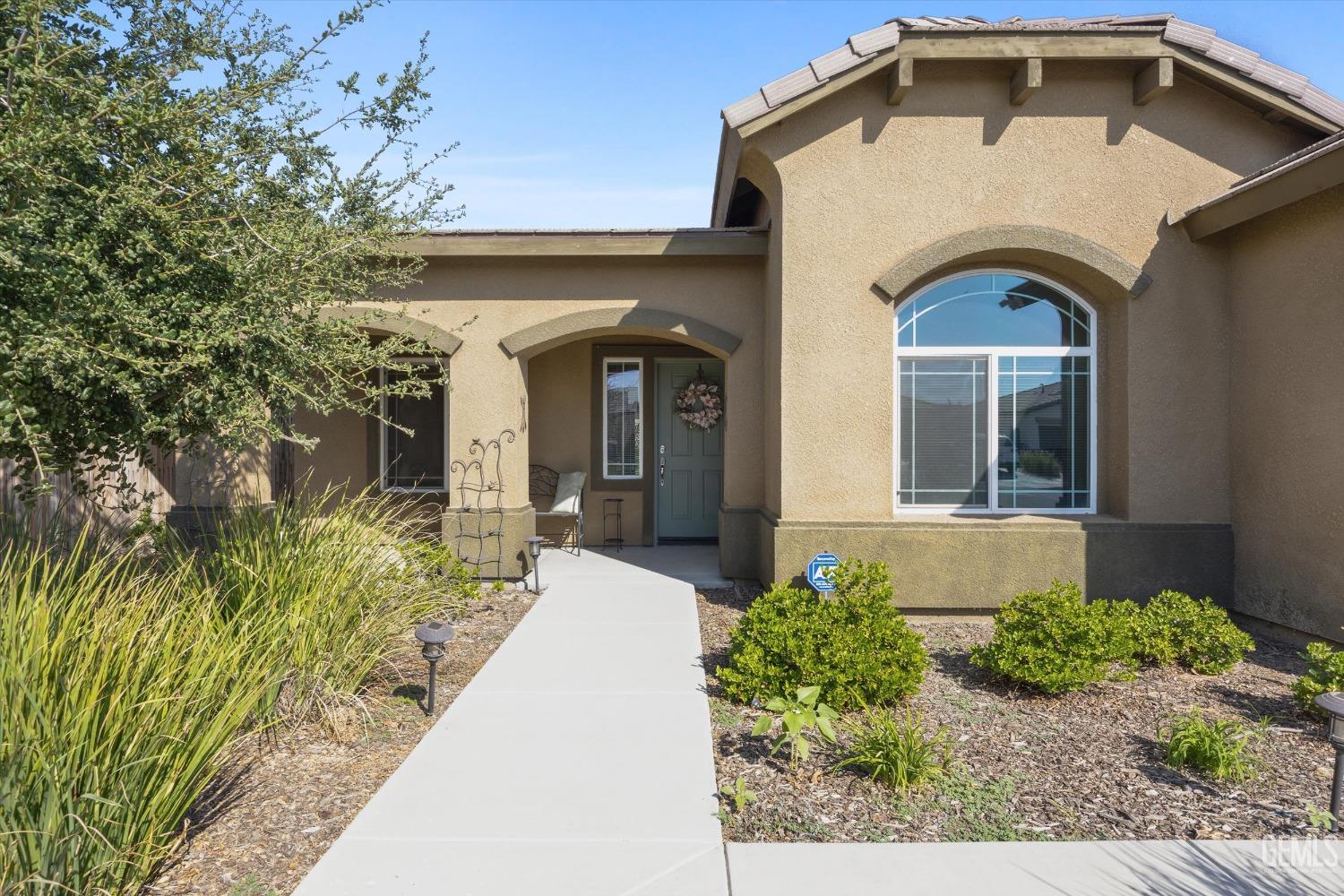 Undisclosed Address Bakersfield, CA 93313 - Photo 4 of 28 a view of a house with garden