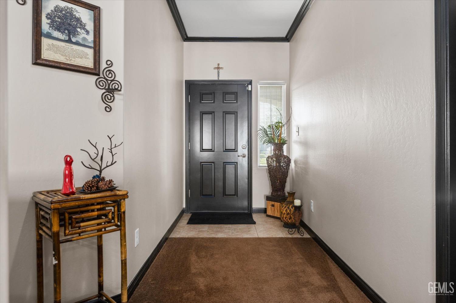 Undisclosed Address Bakersfield, CA 93313 - Photo 6 of 28 a view of a hallway with closet and mirror
