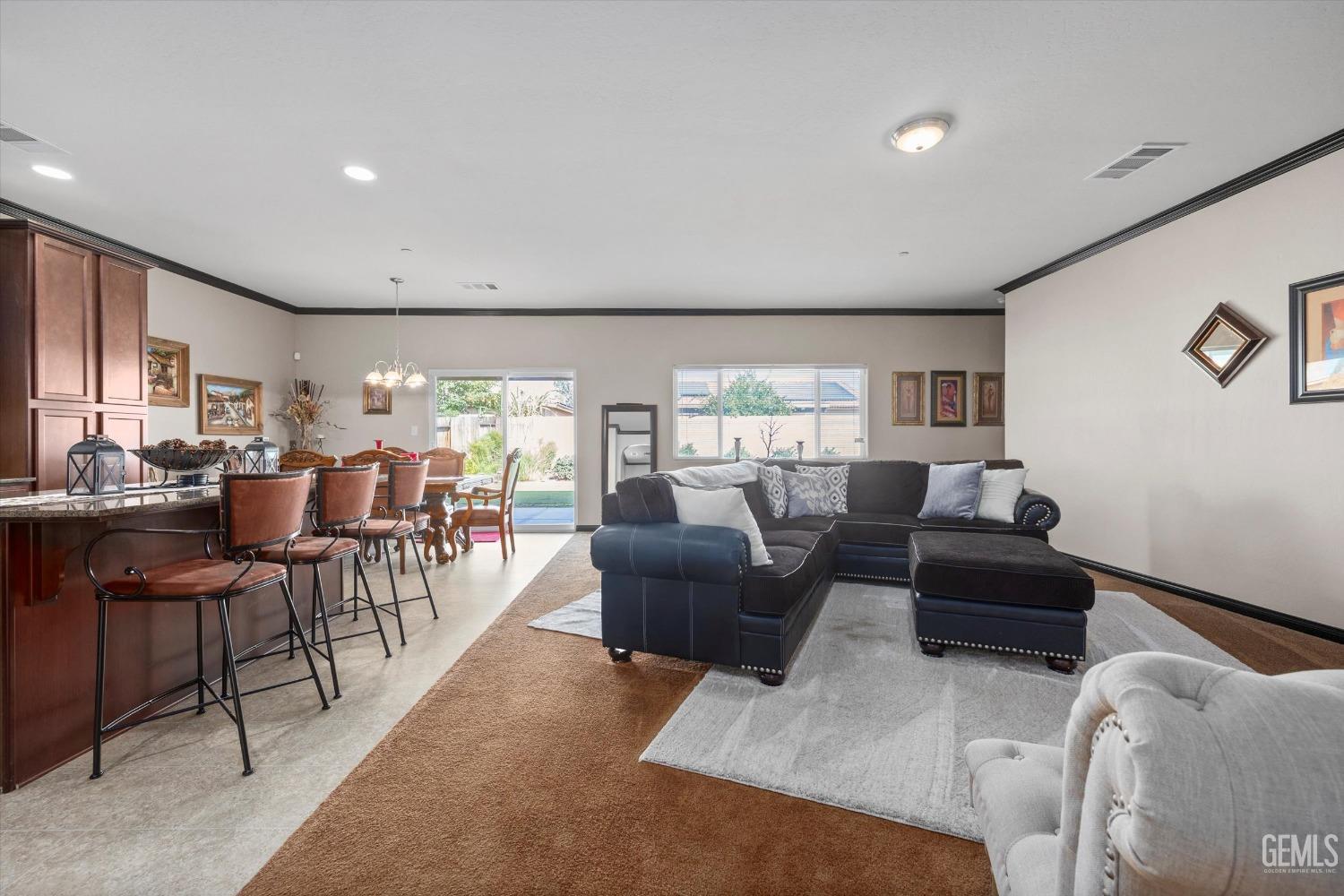 Undisclosed Address Bakersfield, CA 93313 - Photo 7 of 28 a living room with lots of furniture and a large window