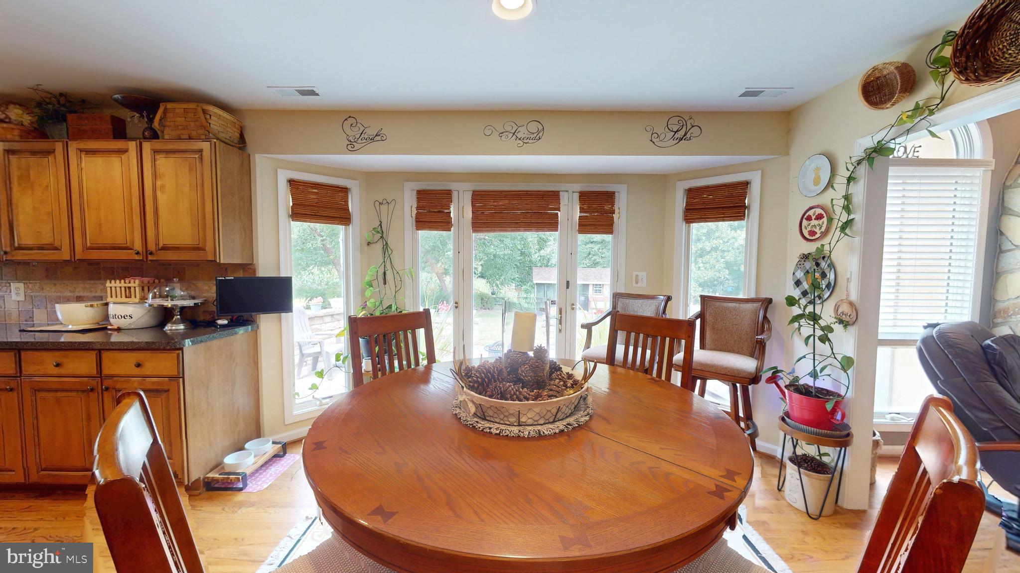 408 Laurens Way Queen Anne, MD 21657 - Photo 19 of 68 a view of a dining room with furniture window and outside view