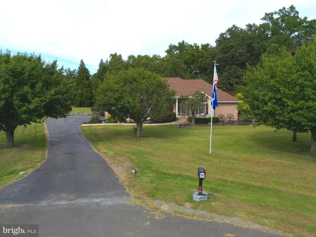 a front view of a house with yard