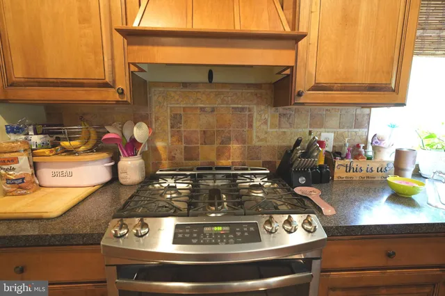 a bedroom with a bed and ceiling cabinets