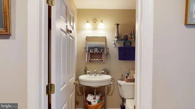 a living room with stainless steel appliances kitchen island granite countertop furniture and a kitchen view