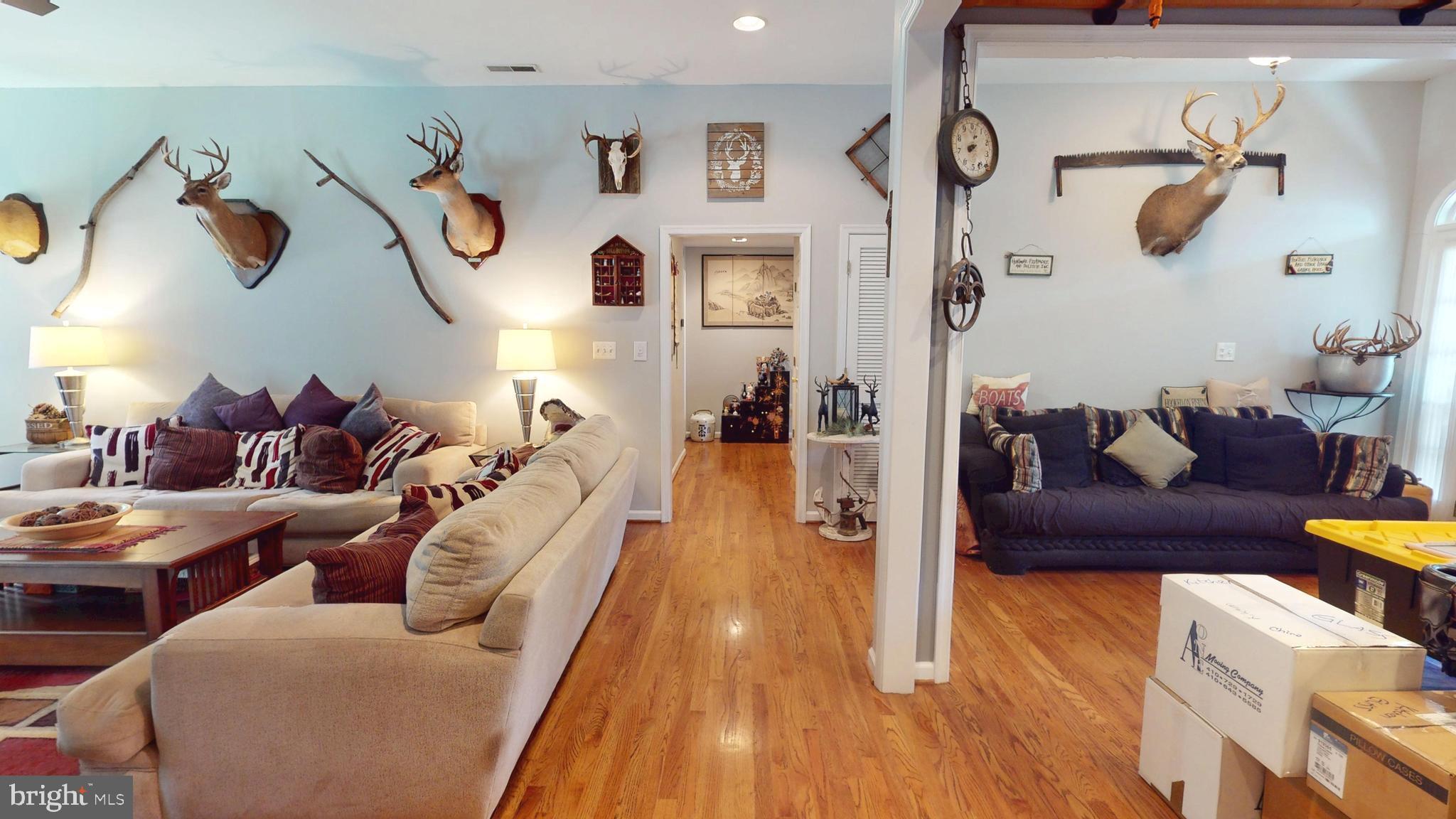 408 Laurens Way Queen Anne, MD 21657 - Photo 29 of 68 a living room with furniture and wooden floor