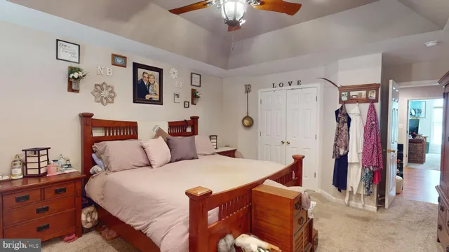 a spacious bedroom with a bed and a window