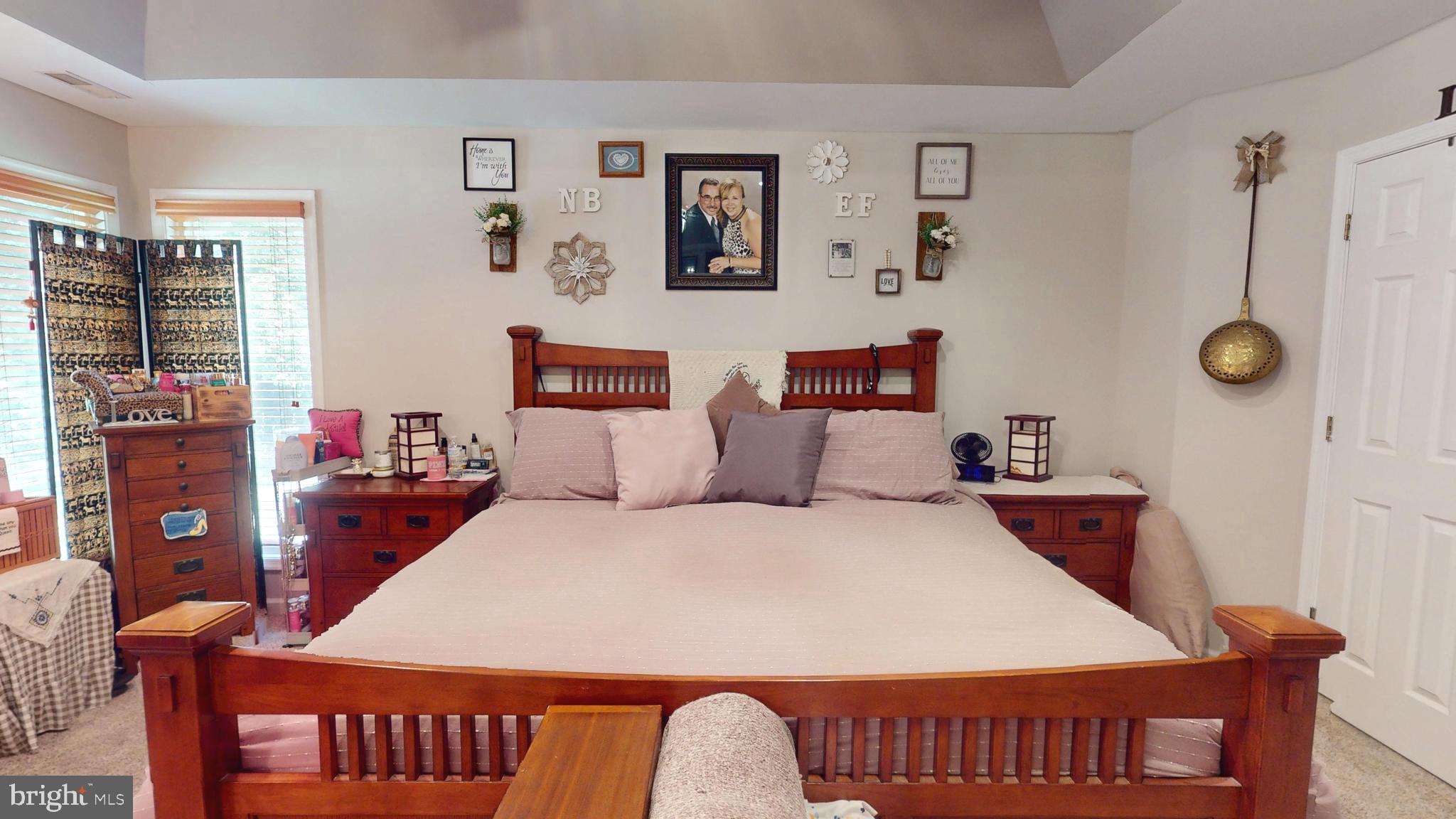 408 Laurens Way Queen Anne, MD 21657 - Photo 33 of 68 a bedroom with a bed and a table in it