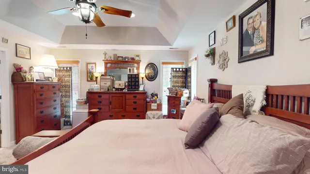 a bed room with a bed and a chandelier