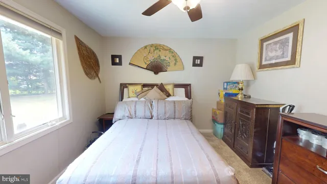 a utility room with dryer washer and a view of living room