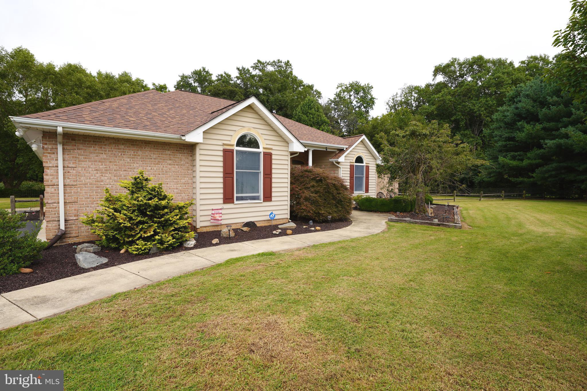 408 Laurens Way Queen Anne, MD 21657 - Photo 4 of 68 a front view of a house with yard