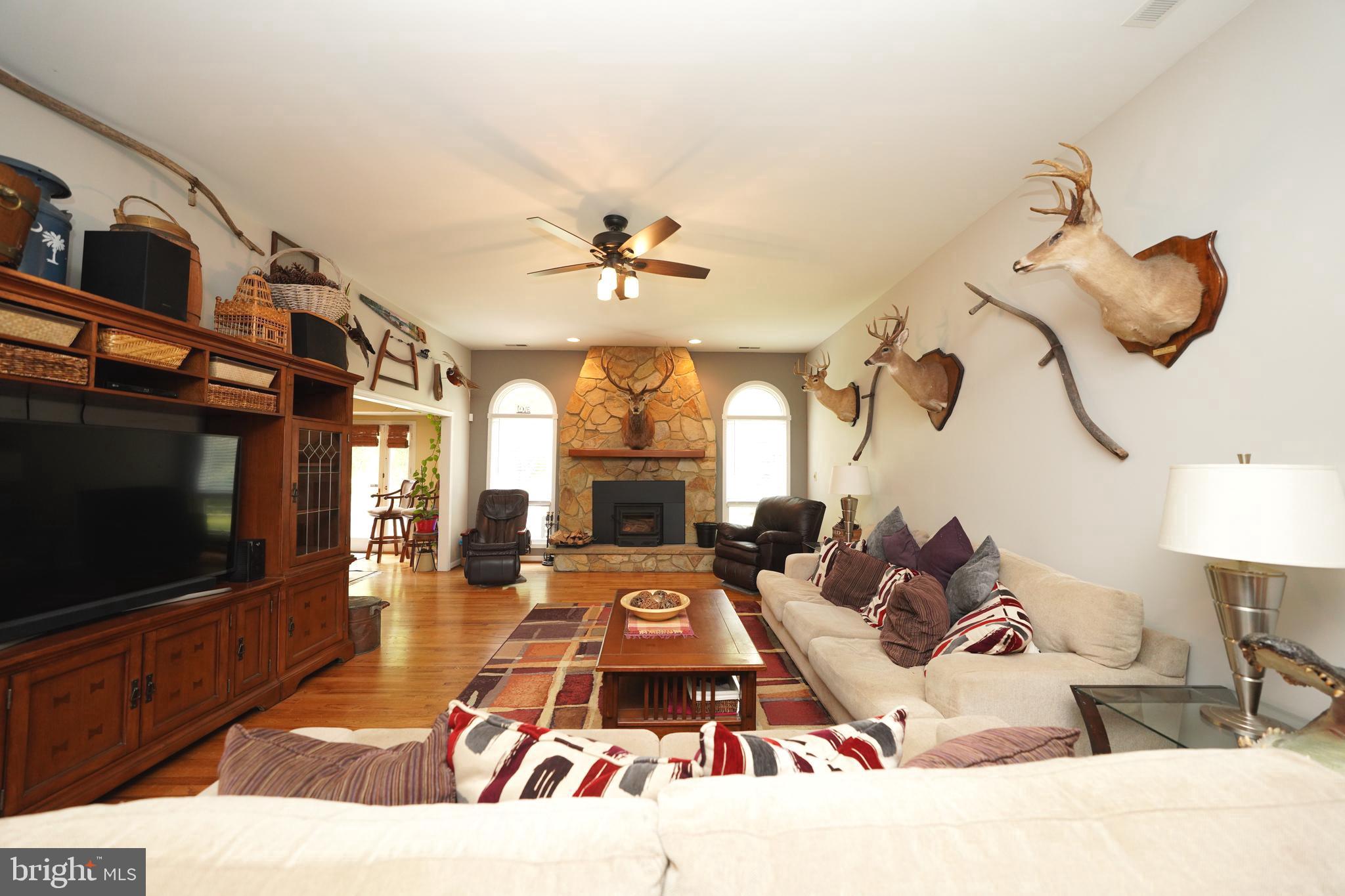 408 Laurens Way Queen Anne, MD 21657 - Photo 43 of 68 a living room with furniture and a flat screen tv
