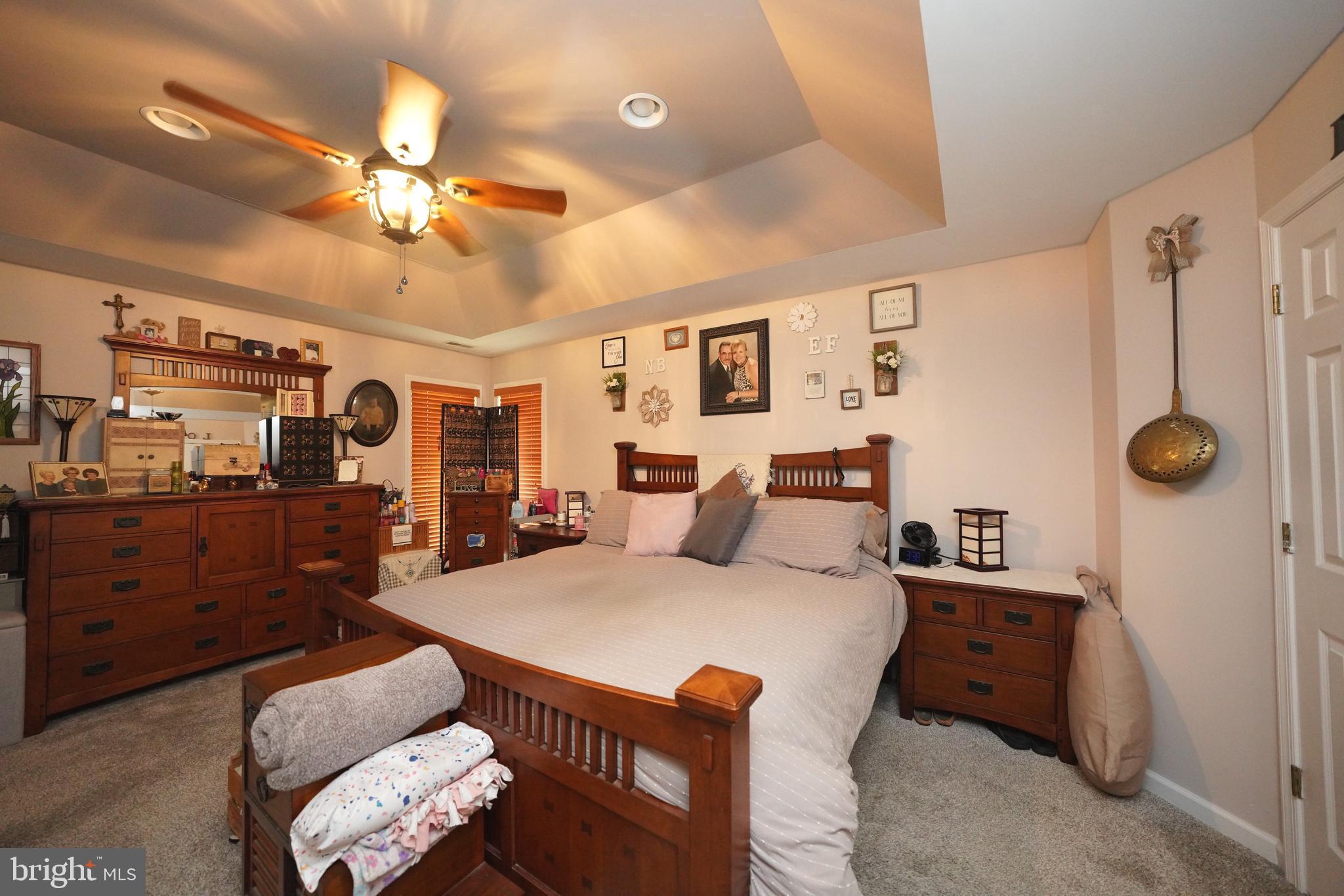 408 Laurens Way Queen Anne, MD 21657 - Photo 45 of 68 a bedroom with furniture and wooden floor