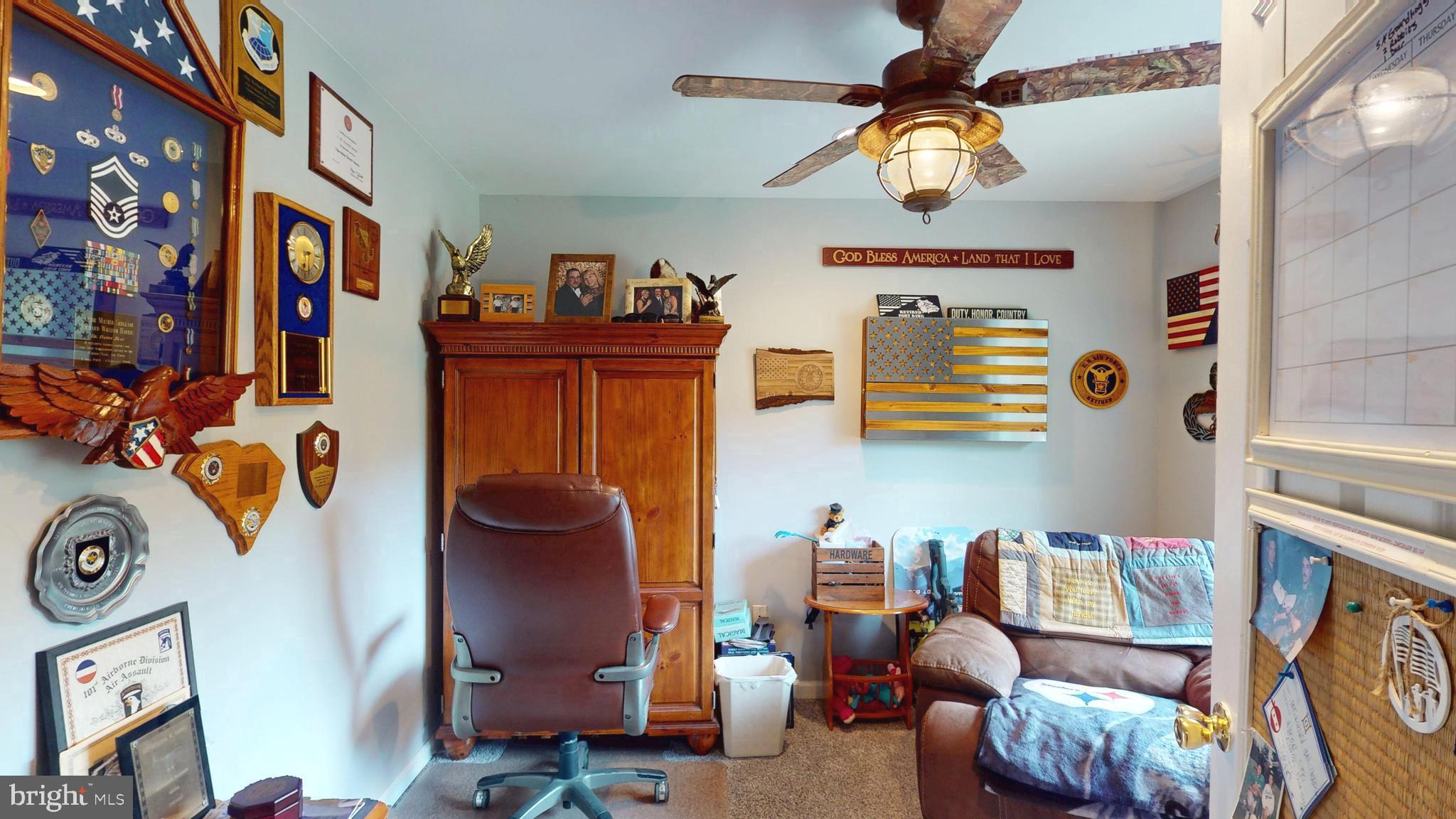 408 Laurens Way Queen Anne, MD 21657 - Photo 50 of 68 a living room with furniture and a chandelier