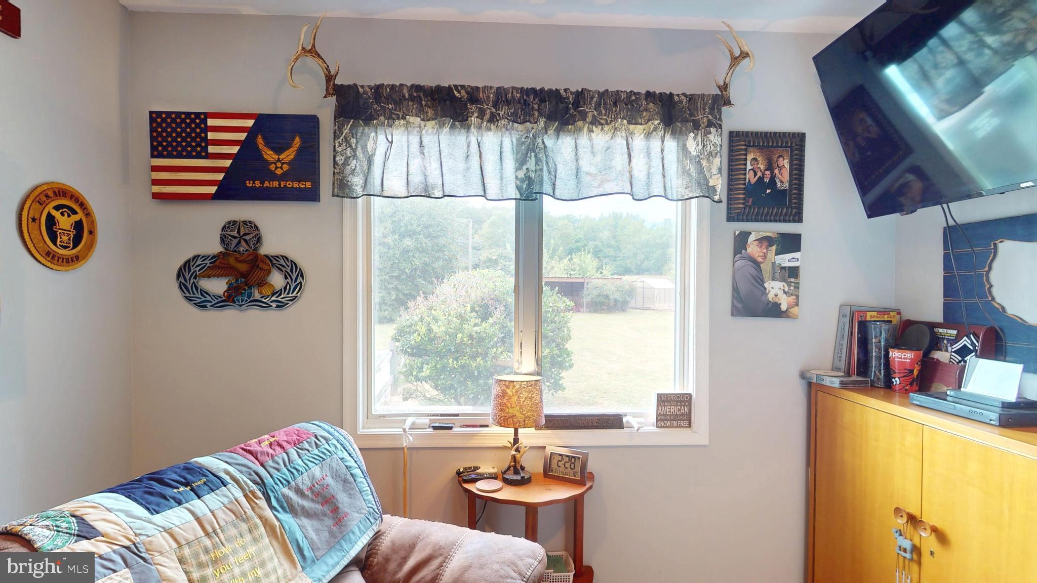 408 Laurens Way Queen Anne, MD 21657 - Photo 51 of 68 a bedroom with a bed and a window