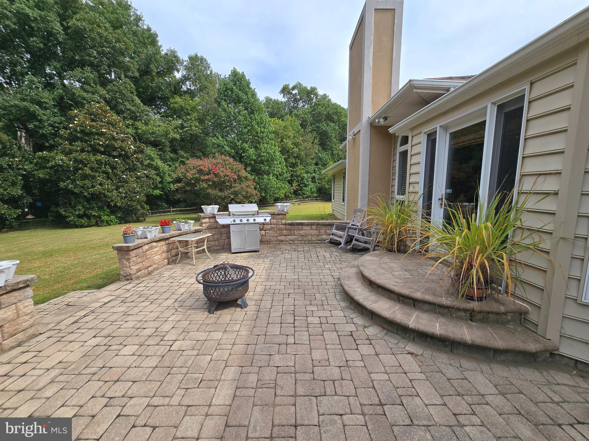 408 Laurens Way Queen Anne, MD 21657 - Photo 54 of 68 a view of a backyard with plants and a fountain