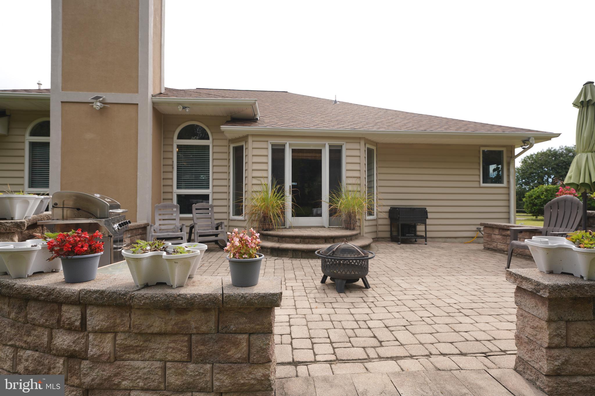 408 Laurens Way Queen Anne, MD 21657 - Photo 55 of 68 a group of people sitting in front of a house