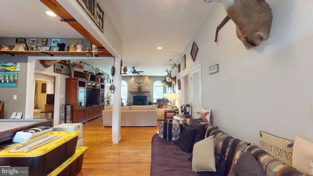 a living room with furniture fireplace and flat screen tv