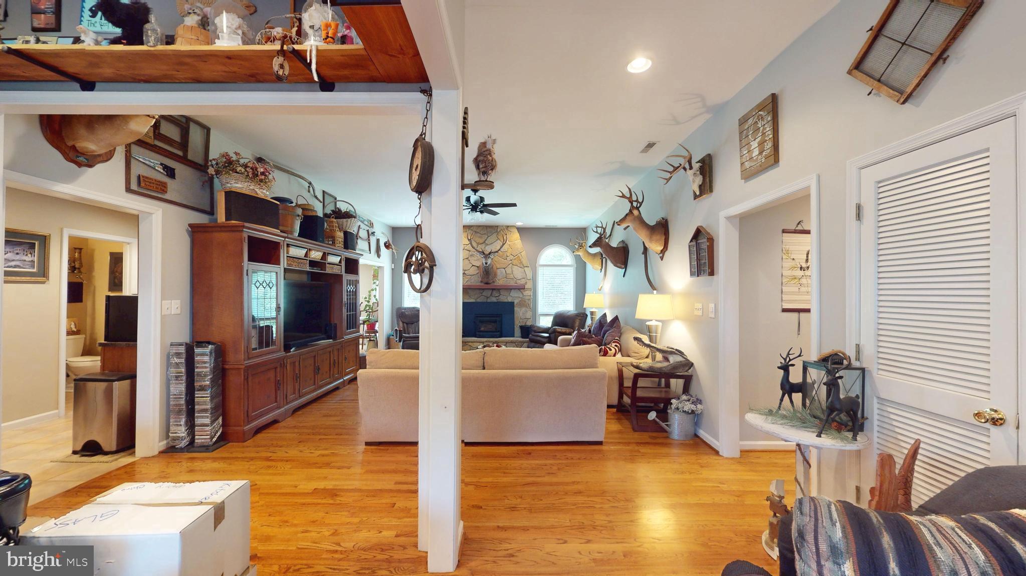 408 Laurens Way Queen Anne, MD 21657 - Photo 8 of 68 a view of a living room kitchen and entryway