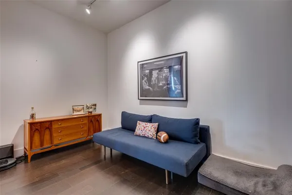a view of workspace with furniture and wooden floor