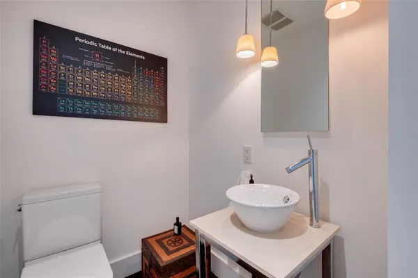 a bathroom with a toilet and a sink