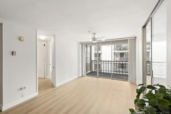 a view of a room with wooden floor